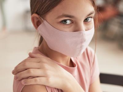Young girl getting vaccine