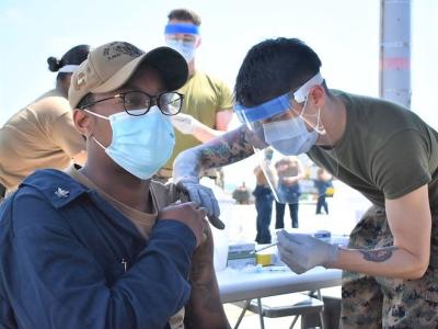 Young man getting COVID vaccine