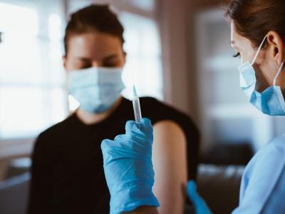 Young woman about to get vaccinated