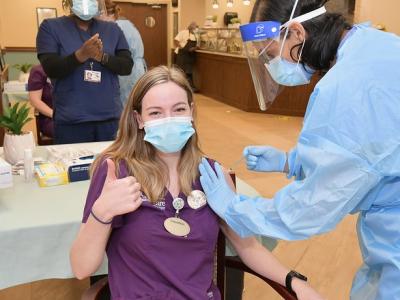 Young woman getting COVID vaccine