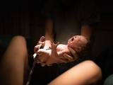 Baby being delivered