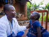 Doctor talking with young girl in Africa