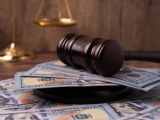 Gavel atop pile of cash