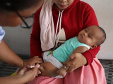 Giving childhood vaccine