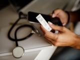 Healthcare worker looking at COVID test results