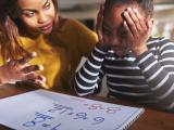 Mom working on math with son