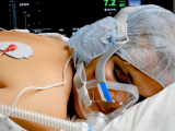 Woman in prone position in hospital