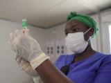 Healthcare worker drawing up syringe