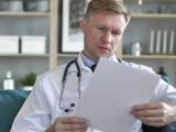 Doctor reading a medical chart