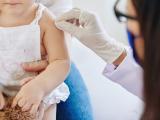 Young child preparing for vaccination