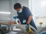 Nurse cleaning hospital bed