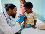 Child about to receive vaccine in doctor's office