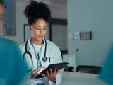 Doctor looking at tablet