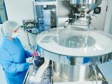 Person working in drug-manufacturing facility