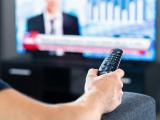 man watching news