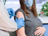 Pregnant woman getting vaccinated