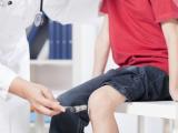 Knee reflex in a child at doctor's office