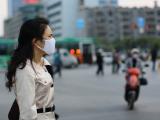 Woman wearing mask on street