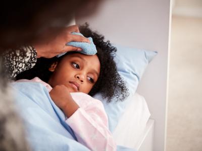 Sick young girl in bed