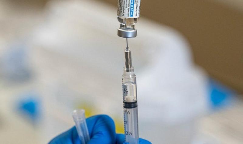 COVID vaccine vial and syringe