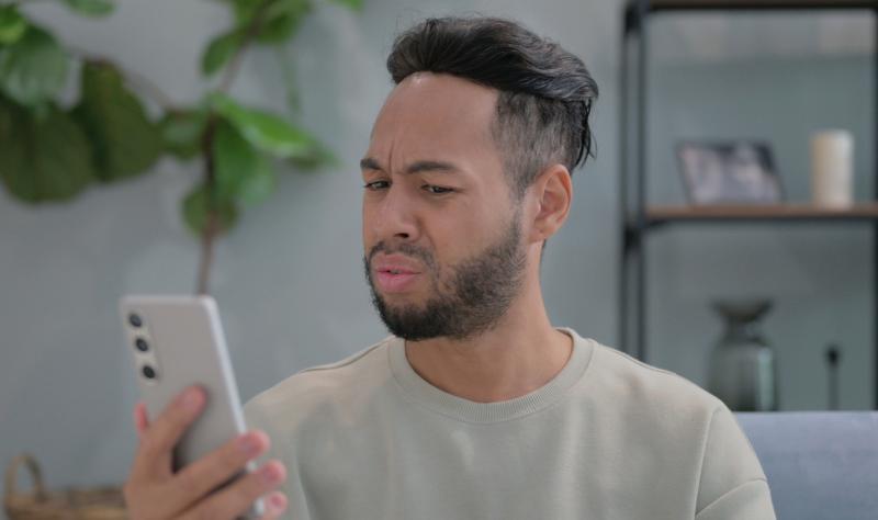 Man on phone not trusting