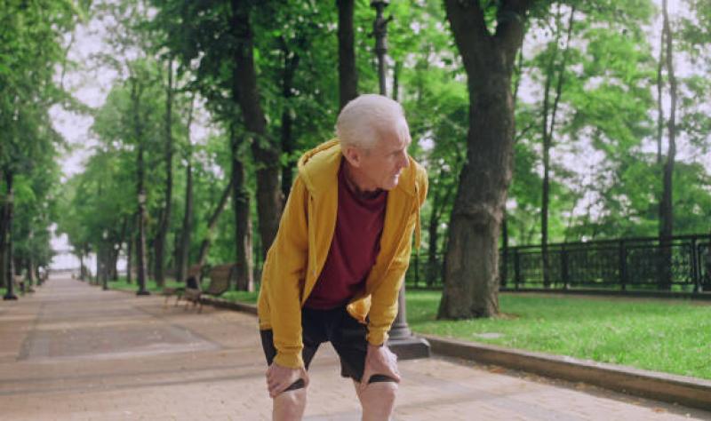 Older man in park with shortness of breath