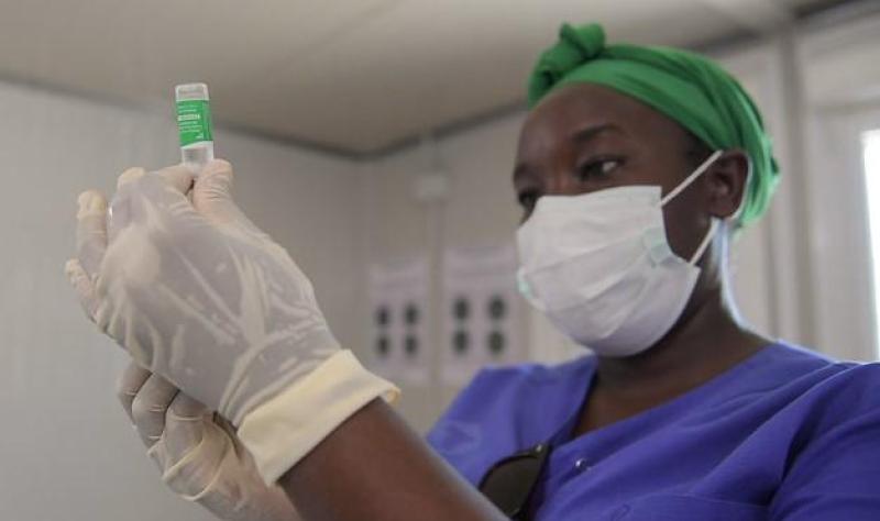 Healthcare worker drawing up syringe