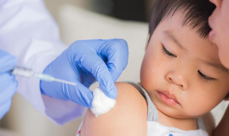 Young child being vaccinated