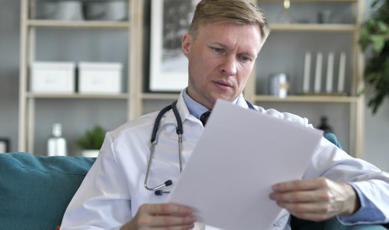 Doctor reading a medical chart