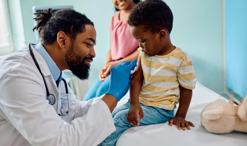 Child about to receive vaccine in doctor's office