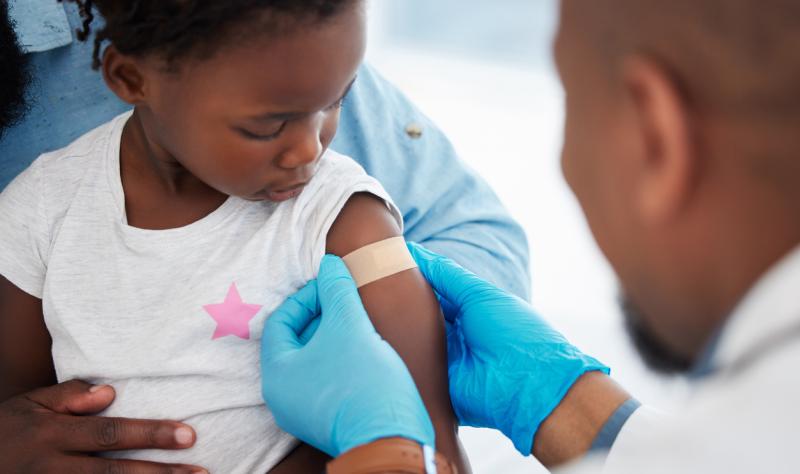 Young black child receiving vaccine 