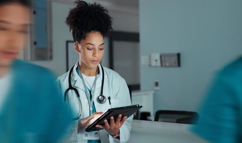 Doctor looking at tablet