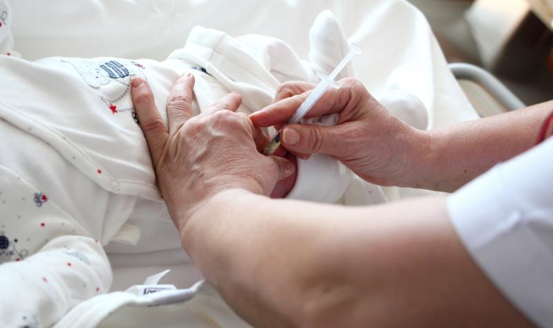 Newborn being vaccinated at hospital