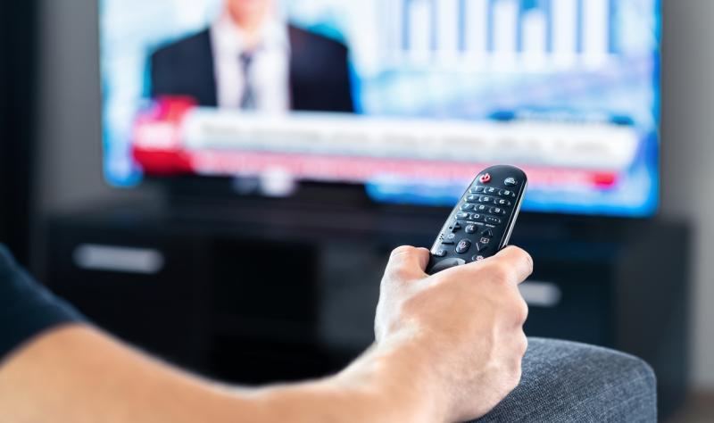 man watching news