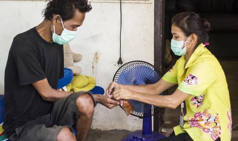 TB patient receiving medicine