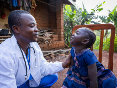 Doctor talking with young girl in Africa