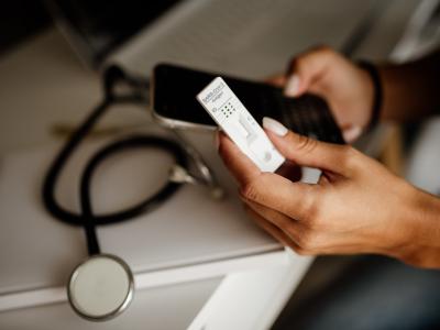 Healthcare worker looking at COVID test results