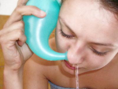 Neti pot in use