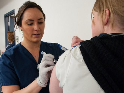 Woman being immunized