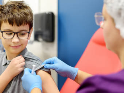 Young boy getting vaccinated