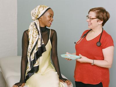 Young woman and vaccine tray