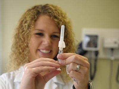 Health worker preparing flu shot