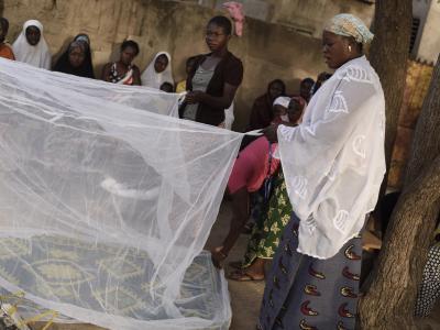 African women with malaria nets