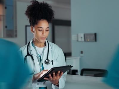 Doctor looking at tablet