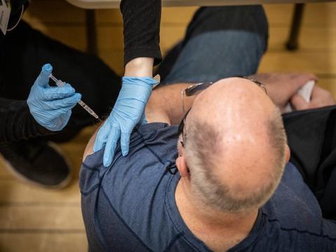 Man getting COVID vaccine