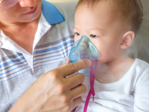 Boy with nebulizer