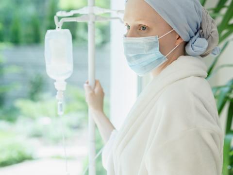 Cancer patient with IV stand