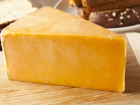 Wedge of cheddar cheese