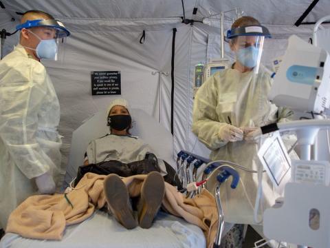 Doctors administering monoclonal antibody therapy