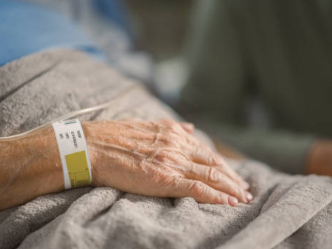 Hand of older man in hospital